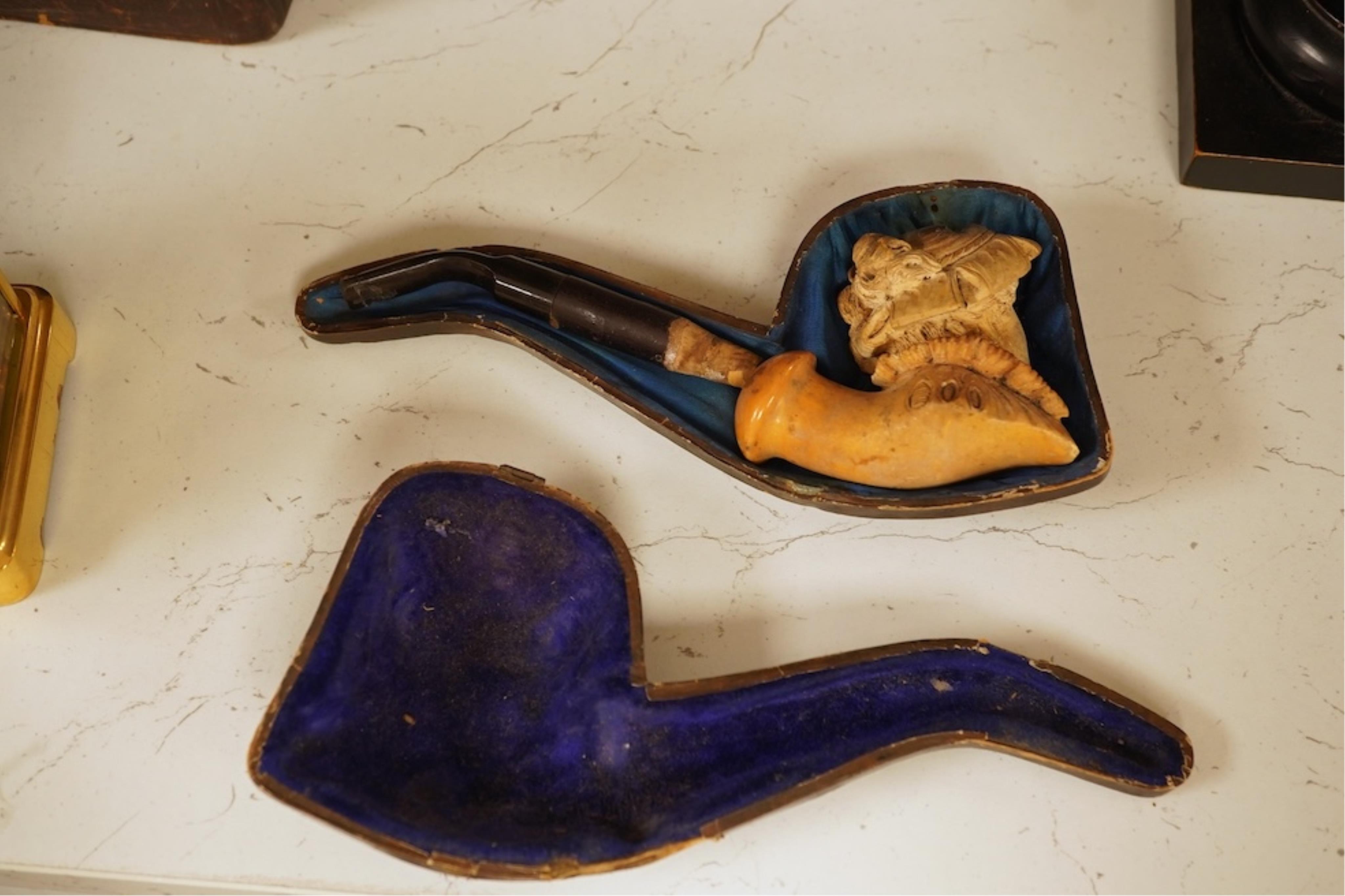 A 19th century German cold-painted terracotta bust, on ebonised socle and a Meerschaum pipe in case, bust 27cm high